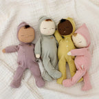 all the dozy dinkums, pip, mini, pickle and moppet laying on a blanket