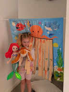 The Cozy Cube sensory pretend play panel with car wash and under the sea scenes