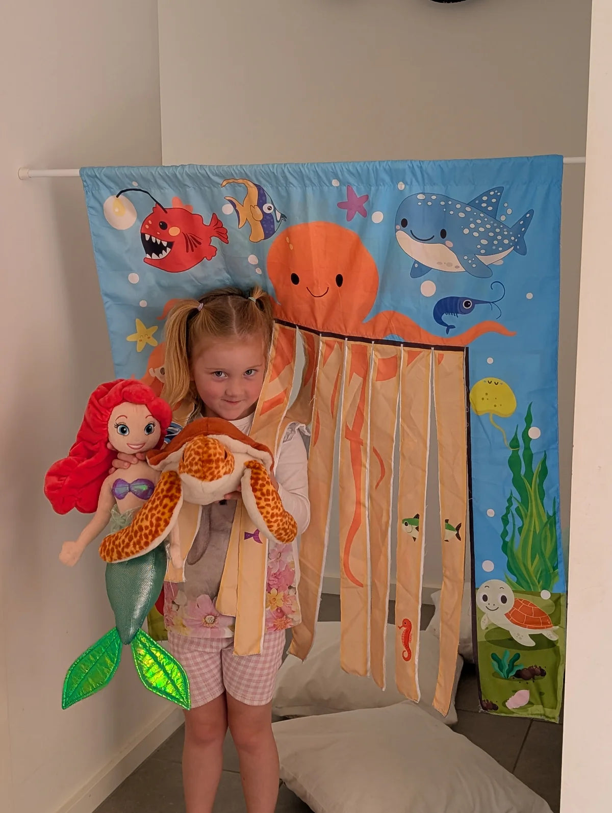The Cozy Cube sensory pretend play panel with car wash and under the sea scenes
