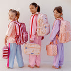 girls modelling Fox & Fallow backpack for kids, perfect for school, daycare and everyday use. Spacious, practical and designed for little adventures. Personalisation of embroidery with name also available on bags in 2 placements. This print is mermaids, peach check and burgundy stripe