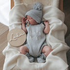 Newborn knit romper bundle with matching booties and beanie for baby boy announcement photos