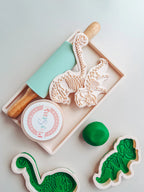 using them image of playdough/clay stamp and cutter. Eco-friendly sensory play tool by brand playsense perfect for creative and imaginative play. can also be used for cookies and baking. pictured is triceratops dino 