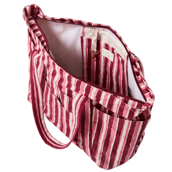 plum and pink striped bag with roomy interior and pockets