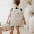 Fox & Fallow sage check backpack worn by child for school or daycare