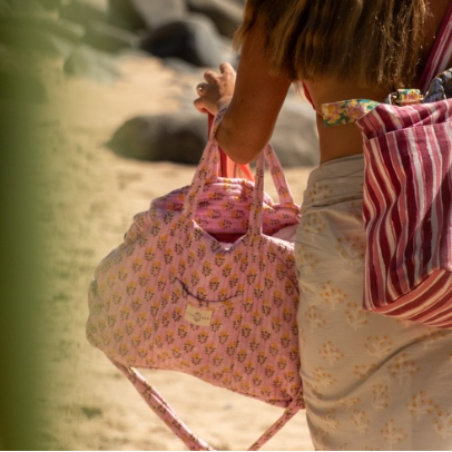 weekend bag for women with soft quilting and gold hardware