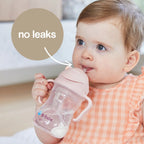baby drinking from a b.box Disney Aurora sippy cup with weighted straw