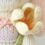 Tiny Lavender bunny doll holding a tulip flower