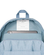 inside view of Corduroy kids backpack with front pocket, laptop sleeve, health label, name label, options to personalise a name with embroidery, spacious. perfect for school or travel. this colour is powder blue