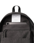 inside view of Corduroy kids backpack with front pocket, laptop sleeve, health label, name label, options to personalise a name with embroidery, spacious. perfect for school or travel. this colour is charcoal