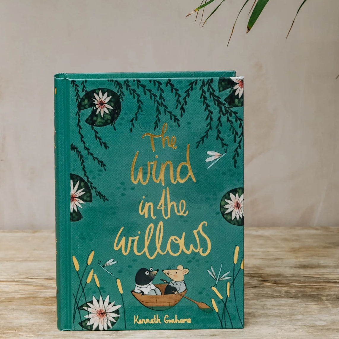 The Wind in the Willows collector’s edition hardback book with green illustrated cover and gold foil lettering by Kenneth Grahame