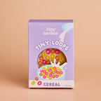 packaging of bowl of tiny tummies tiny loops pretend baby dolls food which is magic and disappearing, perfect gifting brand is tiny harlow and flavour is ceral tiny loops
