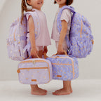 two kids wearing Fox & Fallow backpack for kids, perfect for school, daycare and everyday use. Spacious, practical and designed for little adventures. Personalisation of embroidery with name also available on bags in 2 placements. This print is unicorns and juniper with matching lunch bags