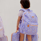 kids wearing Fox & Fallow backpack for kids, perfect for school, daycare and everyday use. Spacious, practical and designed for little adventures. Personalisation of embroidery with name also available on bags in 2 placements. This print is juniper - lilac purple with leaves and unicorns
