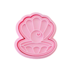 stock image of playdough/clay stamp and cutter. Eco-friendly sensory play tool by brand playsense perfect for creative and imaginative play. can also be used for cookies and baking. pictured is pearl shell