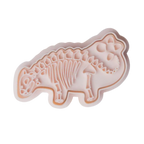 stock image of playdough/clay stamp and cutter. Eco-friendly sensory play tool by brand playsense perfect for creative and imaginative play. can also be used for cookies and baking. pictured is stegosaurus