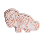 stock image of playdough/clay stamp and cutter. Eco-friendly sensory play tool by brand playsense perfect for creative and imaginative play. can also be used for cookies and baking. pictured is triceratops dino