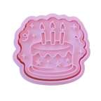 stock image of playdoughc/clay stamp and cutter. Eco-friendly sensory play tool perfect for creative and imaginative play. can also be used for cookies and baking. pictured is party cake