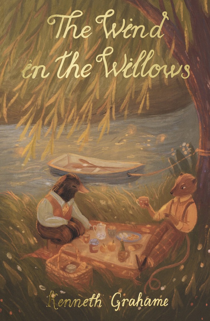 The Wind in the Willows paperback book by Kenneth Grahame with illustrated cover showing woodland animals having a picnic by the river