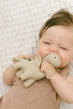 Natural rubber dinosaur teether for babies in sage by Winnie Parkes