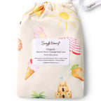 Snuggle Hunny Beach Fun organic bassinet sheet in matching drawstring bag featuring colourful beach and summer themed print