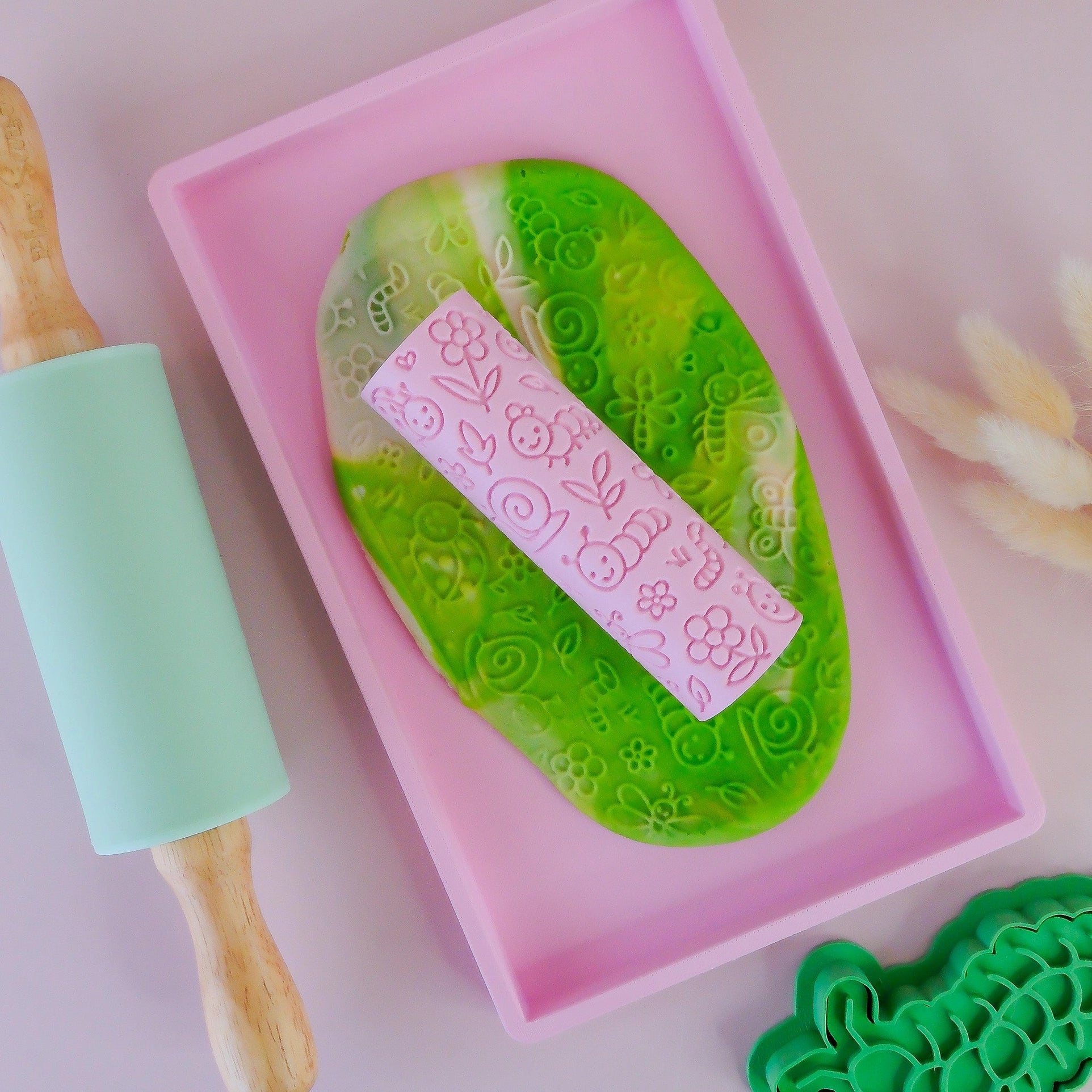 how to use Image of eco textured dough roller designed with fun patterns and to be used with sensory like playdough or can be used for cooking dough. Textured roller is in the pattern bug life