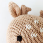 Close up detail of Cuddle+Kind baby fawn hand knit fabric texture and stitching