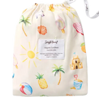 Snuggle Hunny Beach Fun organic fitted cot sheet folded inside matching drawstring bag with colourful summer beach print