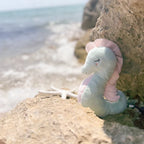 at the beach seafoam-green body and blush-pink fins shelley seahorse by brand mon ami. soft toy plushy