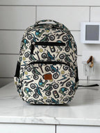 front view of Mini & Mum kids backpack with insulated interior for daycare and outings. can be personalised with childs name. this print is motorbike mania with motorbikes and wrenches, helmets, lighting bolts and smiley faces