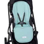Reversible organic pram liner installed in stroller providing comfort padding and protection for everyday outings