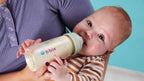 b.box baby bottle 240ml being used for comfortable feeding with ergonomic design