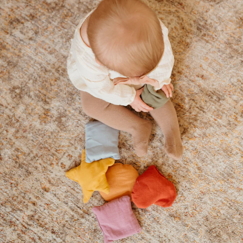 baby playing with Little Lamb Kind shapes beanies soft sensory shapes toy