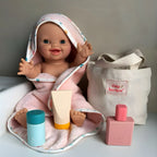 showcasing the tiny harlow bath accessory pack that comes with a bag, body lotion,baby doll towel, baby powder and bubble bath all for pretend play with dolls called tiny bath time