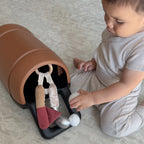 toddler playing with golf themed baby toy