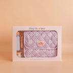 lilac daisy baby dolls nappy bag in the gift box by the brand tiny harlow with doll food and doll milk bottle