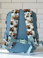 back view of Mini & Mum kids backpack with insulated interior for daycare and outings. can be personalised with childs name. this print is digger dreaming. blue or sage checkers with digger construction trucks vehicles over it

