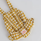 baby dolls carrier made by tiny harlow - empty to show product for pretend play, the print is mustard gingham