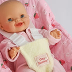 close up of strawberry picnic Dolls Car Seat Capsule by tiny harlow with a doll inside