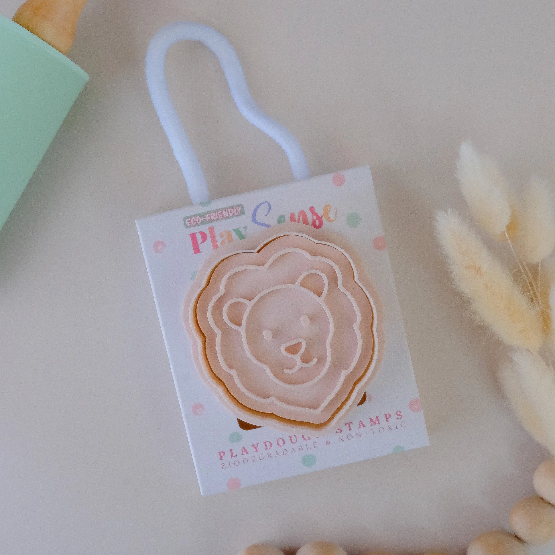 photoshoot image of playdough/clay stamp and cutter. Eco-friendly sensory play tool by brand playsense perfect for creative and imaginative play. can also be used for cookies and baking. pictured is lion