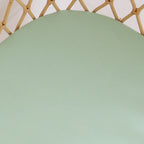 Close up of mint organic cotton bassinet sheet showing smooth stretch jersey fabric and soft breathable texture