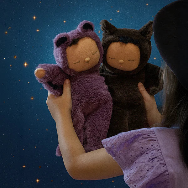 Dark brown bat Cozy Dinkum doll on moody or night theme background