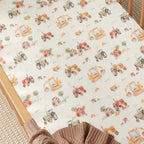 Close up of Diggers & Tractors organic cotton fitted cot sheet showing construction vehicle print on soft breathable jersey fabric