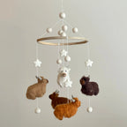 Handmade Highland cow baby mobile with wool felt farm animals for nursery décor by Ganapati