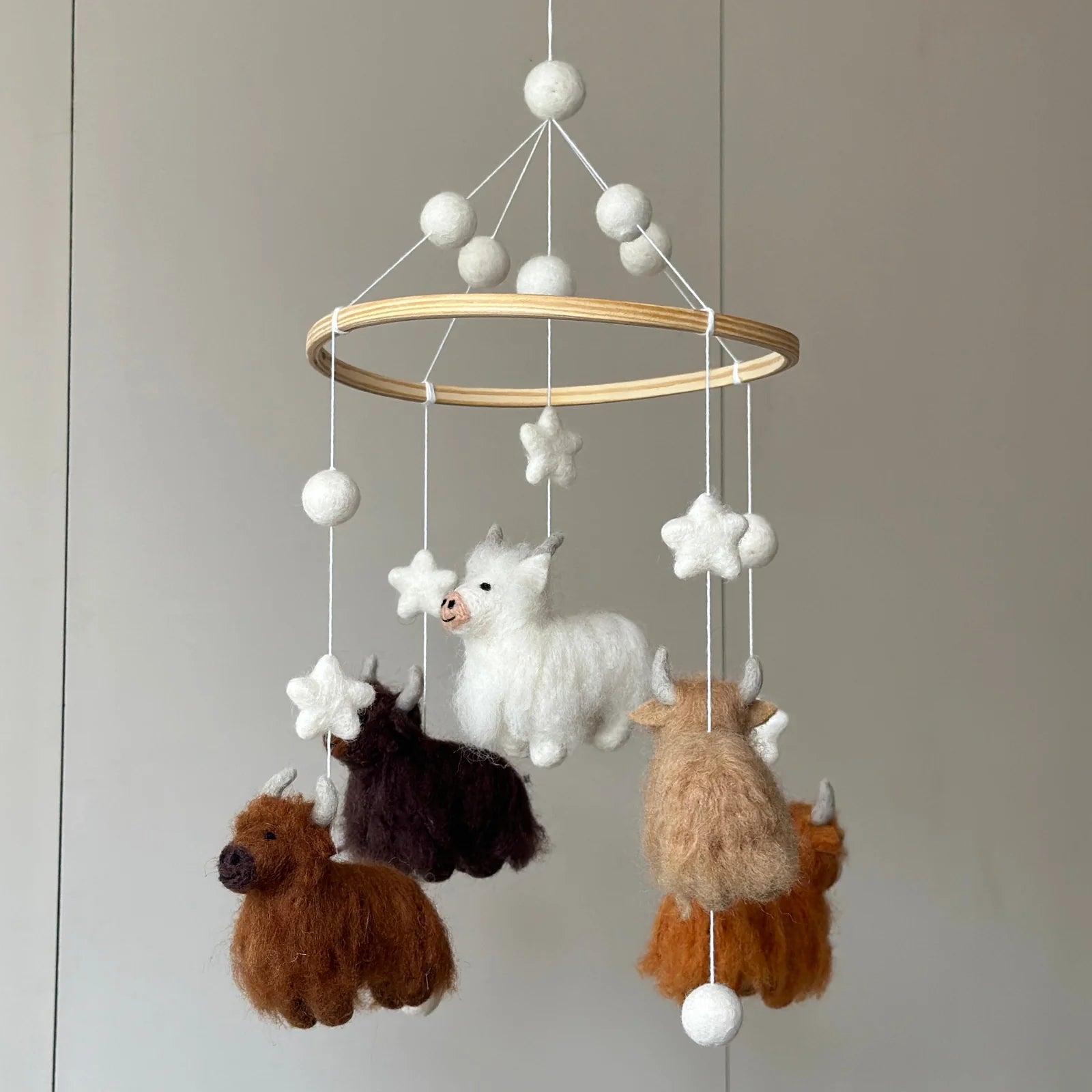 Ganapati Highland Cow Felt Baby Mobile featuring handcrafted fluffy wool felt cows