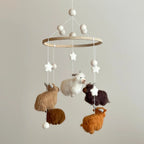 Neutral nursery baby mobile with handmade Highland cow felt animals and wooden hanging frame