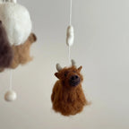 close up highland cow felt mobile