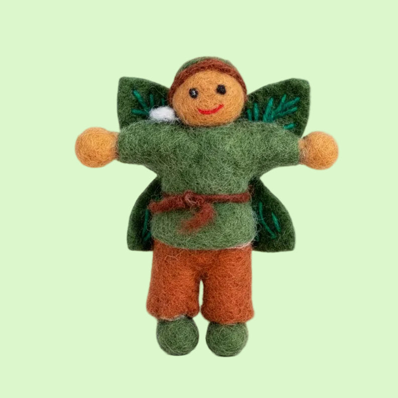 A small felted wool fairy doll with a green tunic, orange pants, green wings, and a brown headband, centered on a plain white background.