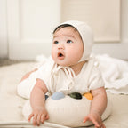 baby using soft tummy time support pillow for rolling and crawling practice
