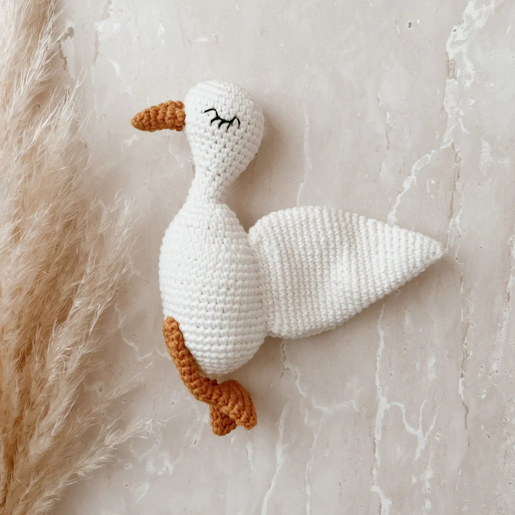 Goose crochet baby rattle by Blossom and Pear handcrafted in soft milk cotton