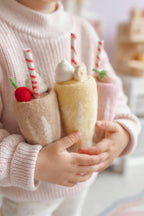 child holding felt strawberry, chocolate and banana milkshake toy handmade wool pretend play drink diner Juni Moon
